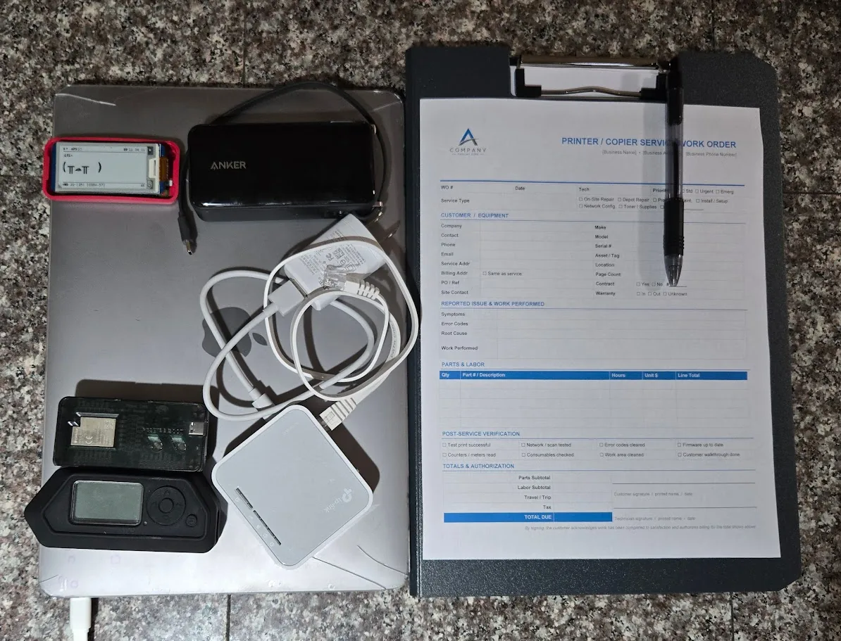 Physical pentest loadout: laptop, Flipper Zero, Anker battery pack, charging brick with Ethernet cables, Raspberry Pi running Pwnagotchi, a TP-Link AC750 travel router, and a clipboard with a printer/copier Work Order template.